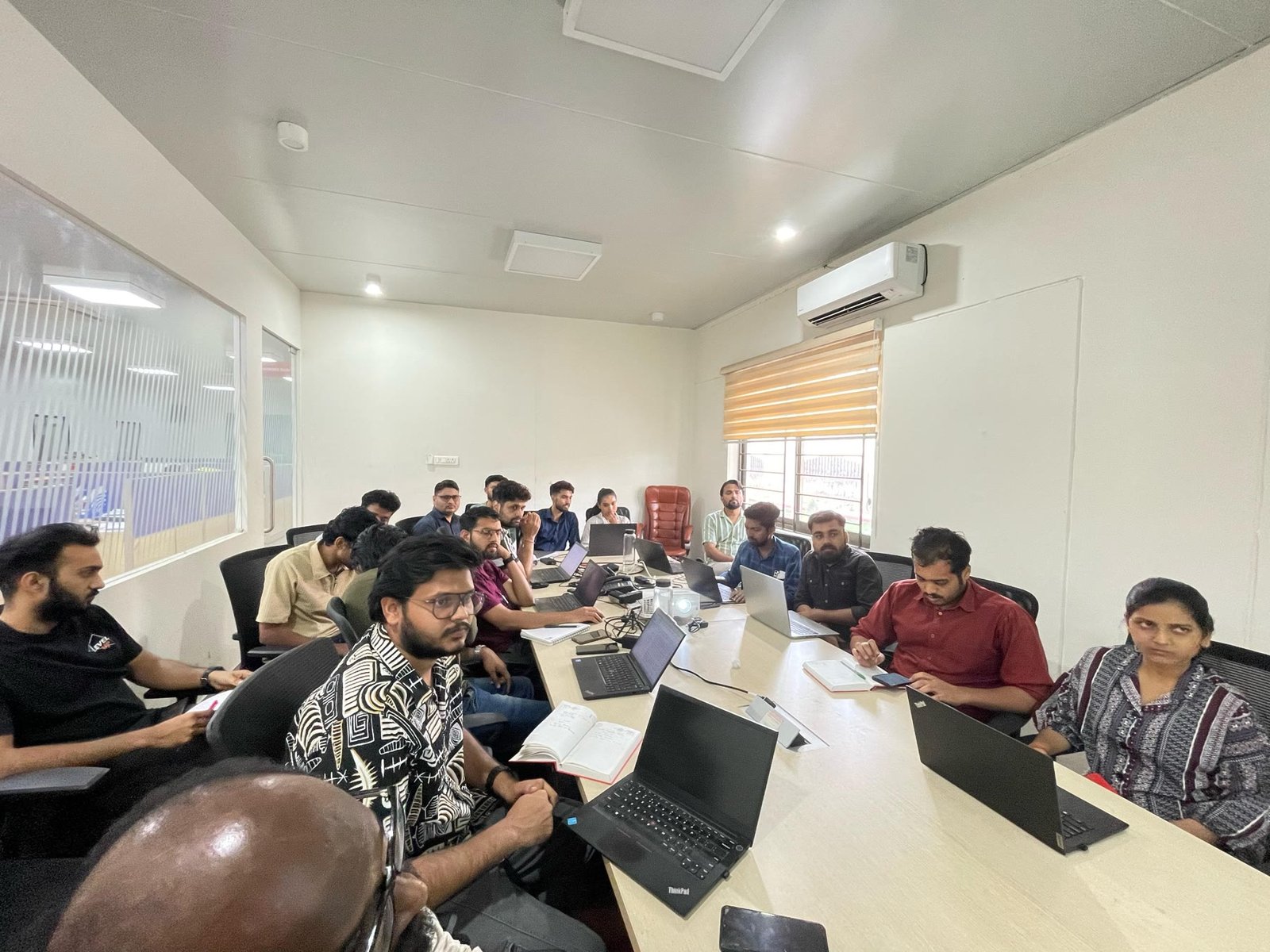 Participants building real workflows on their own laptops during a Growcial session at Walkaroo